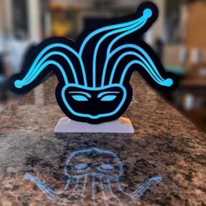 Blue neon mask lamp on kitchen counter